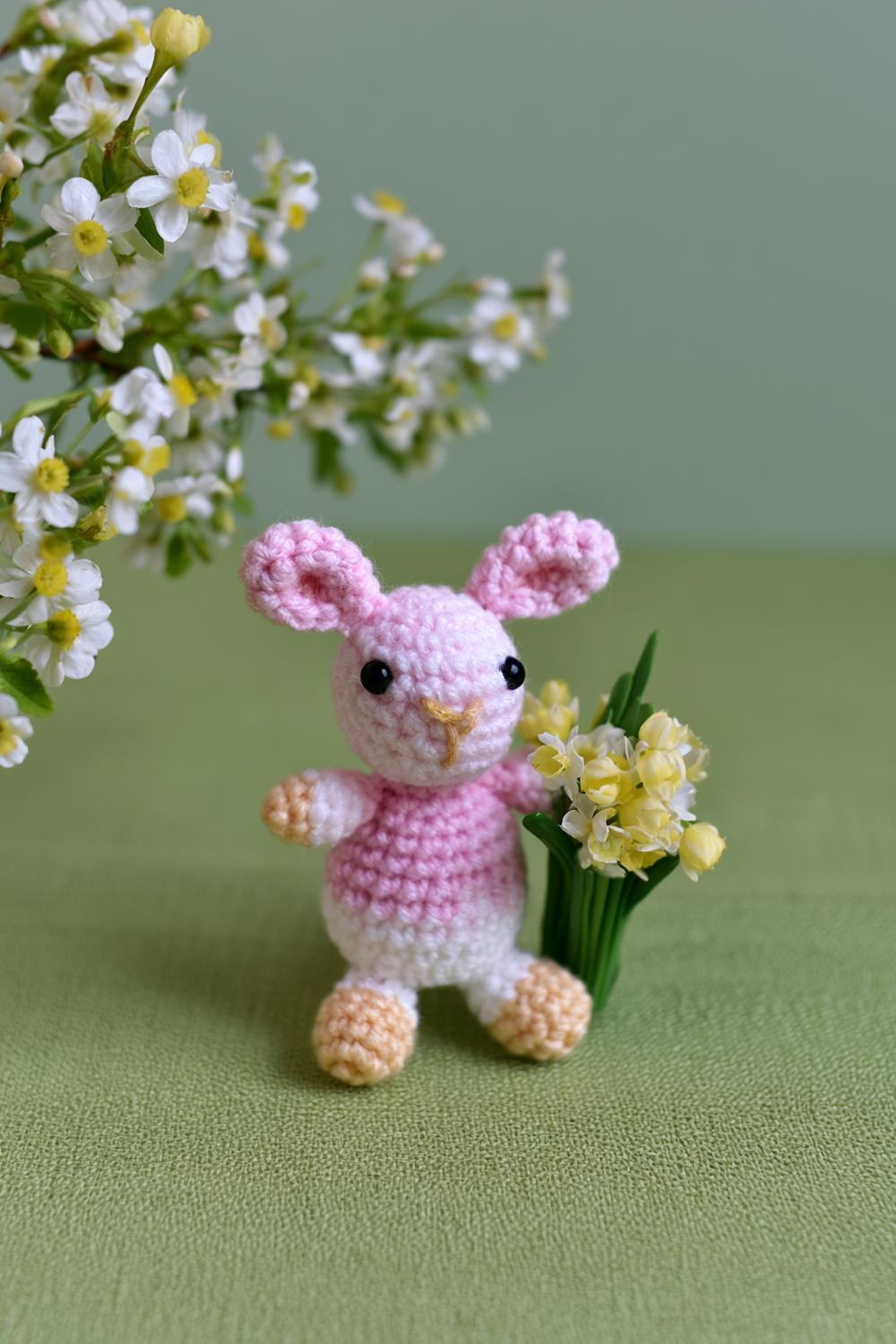 Rosa Häschen mit Blumenstrauß
