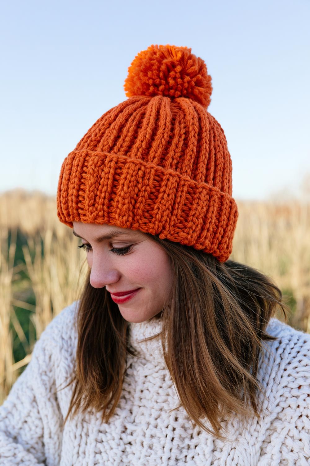 Orange Rippenmütze mit Bommel